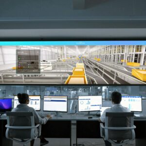 Modern control room with people monitoring large digital displays and computer systems.