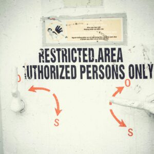 Close-up of a restricted area door with signage emphasizing authorized access only.